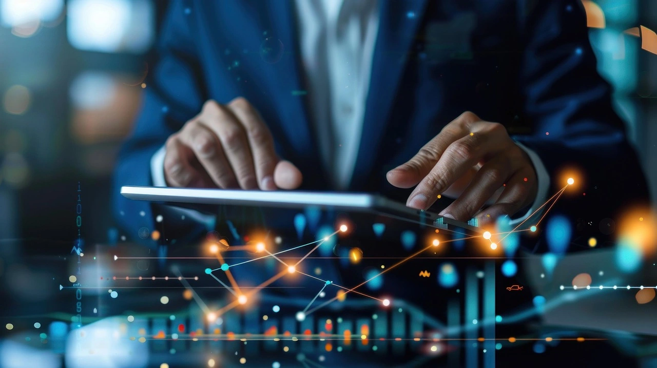 Businessman analyzing data on a tablet, with a data chart displayed in the background.